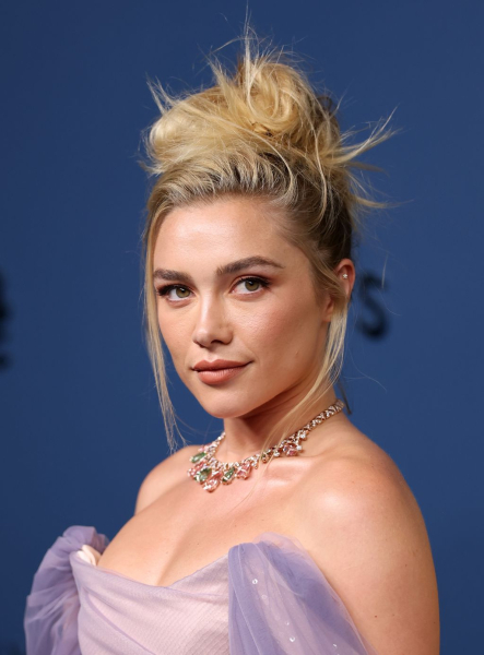 Florence Pugh posing in a lavender gown